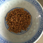 A small saucer of fenugreek seeds